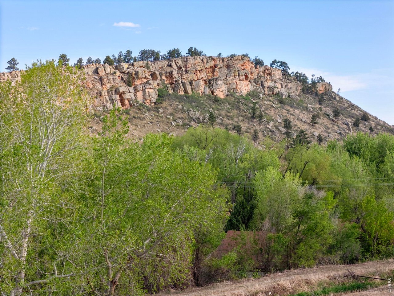 The property is wooded and set just West of the City of Loveland. 