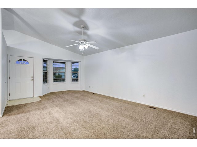 Property Photo 2 Large front living room with bay window 