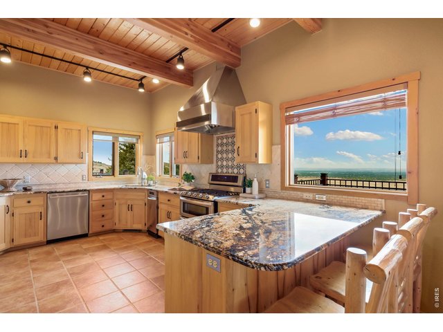 Property Photo 7 Tile flooring, stunning countertops, and breakfast bar! 