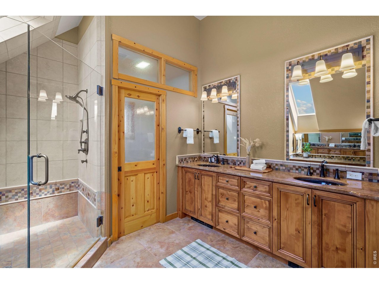 Double vanity and walk in shower in primary bath 
