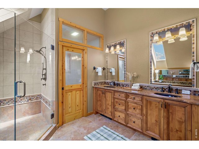 Property Photo 23 Double vanity and walk in shower in primary bath 
