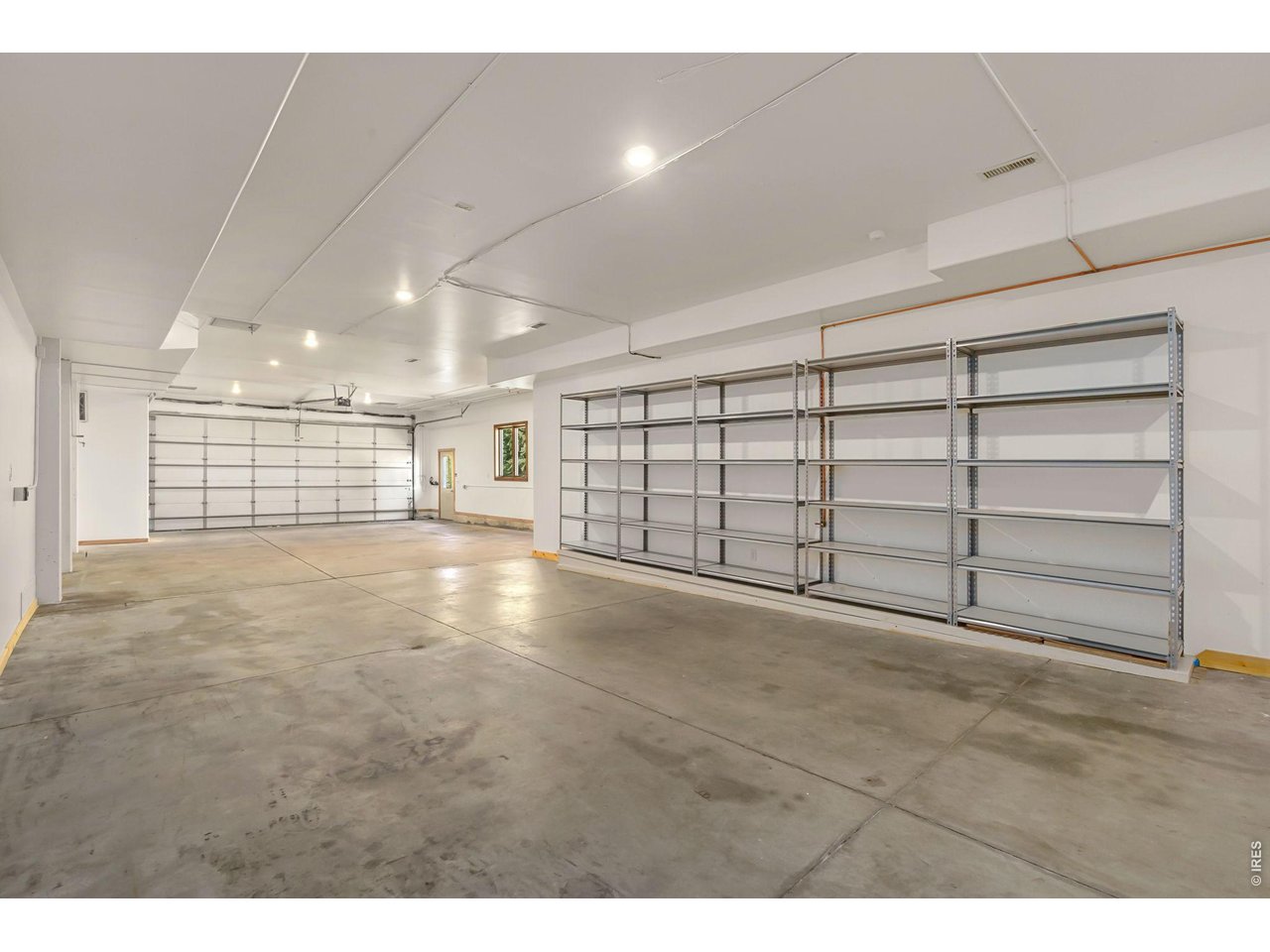 Garage space galore! Bring the vehicles! Built in shelving and storage closet! 