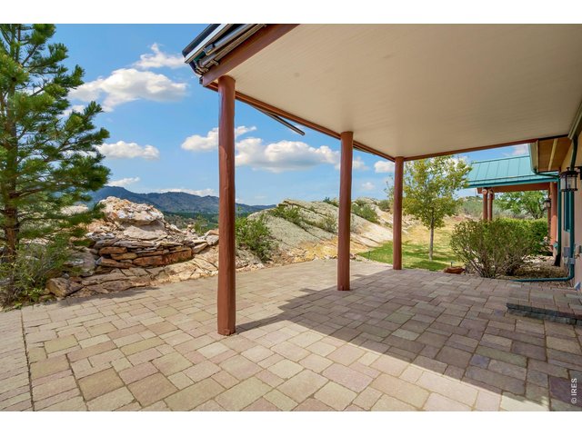 Property Photo 37 Covered patio facing west with awnings