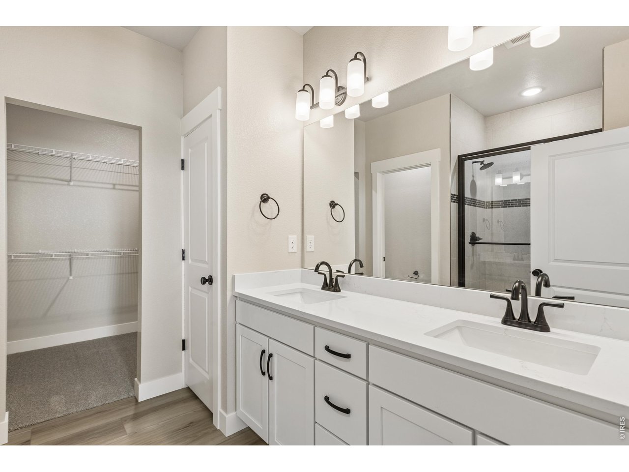 Property Photo 13 Primary bathroom with dual vanities. 