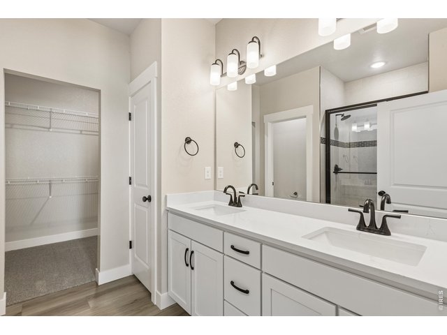 Property Photo 13 Primary bathroom with dual vanities. 