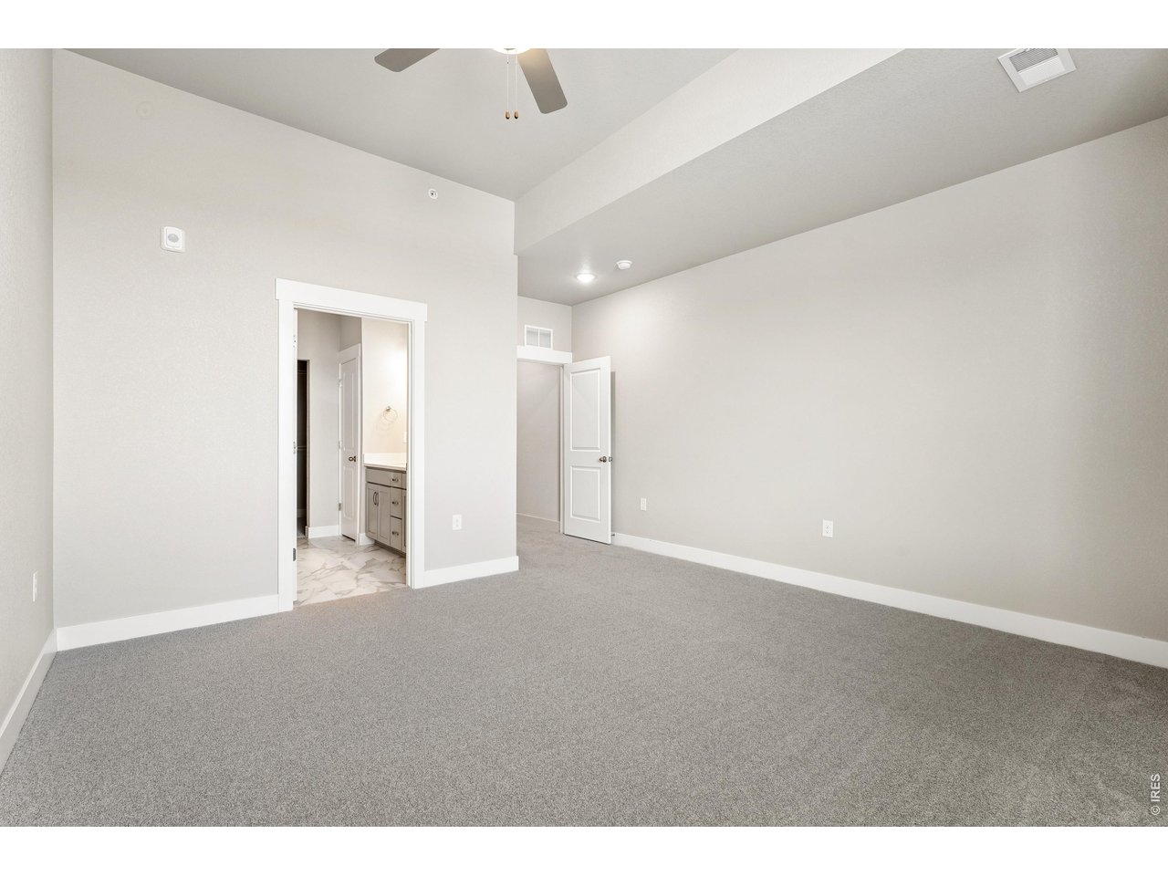 Property Photo 11 Primary bedroom with ceiling fan included!