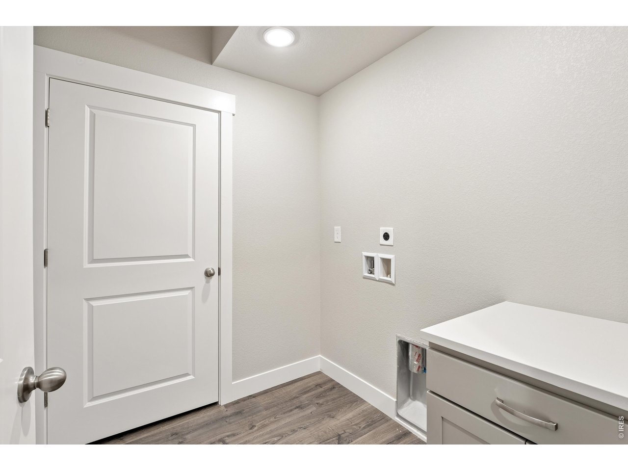 Property Photo 10 Laundry room with built in cabinet, included. 