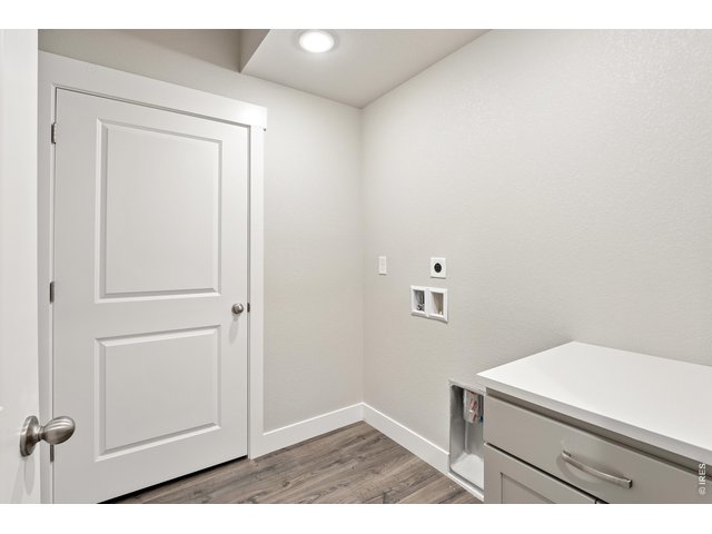 Property Photo 10 Laundry room with built in cabinet, included. 