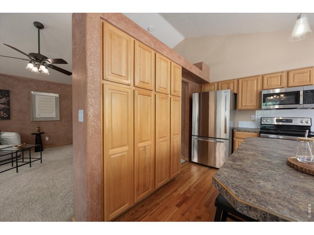 Property Photo 16 Spacious double cabinet pantry for organized everyday living