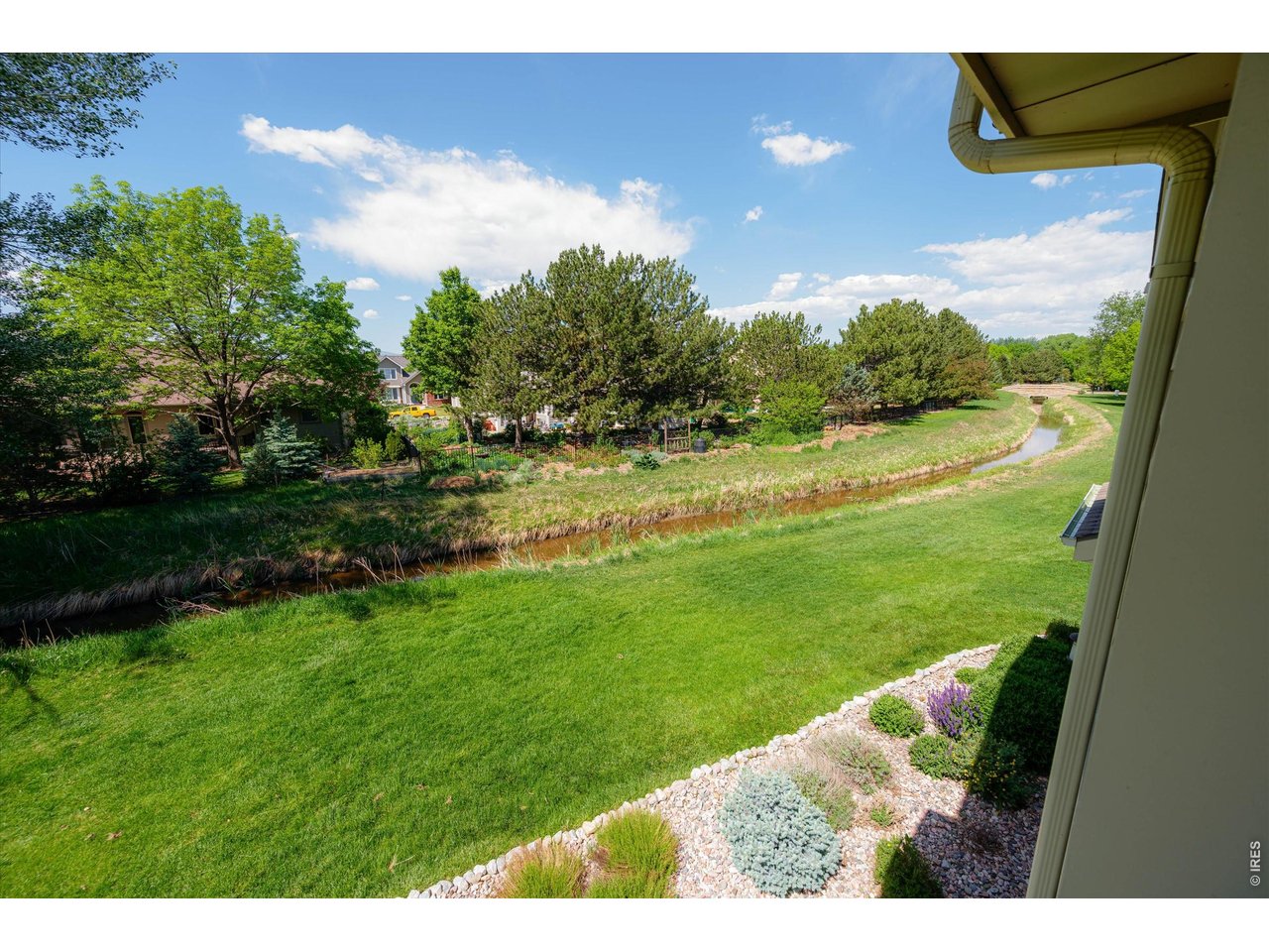 View from the living room overlooking beautifully maintained green space cared for by the HOA.