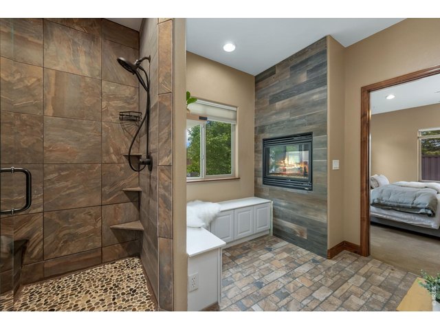 Property Photo 21 Custom shower with stone floor