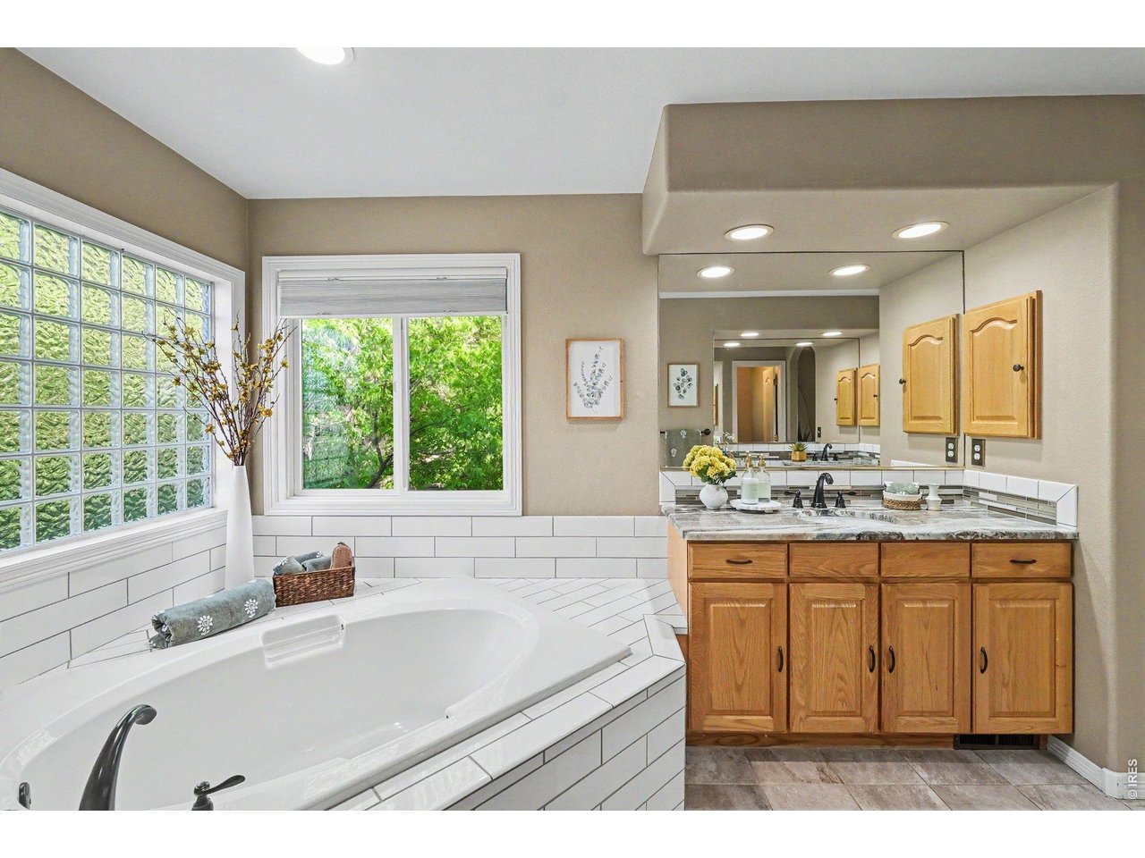 primary bathroom with two separate vanity sinks