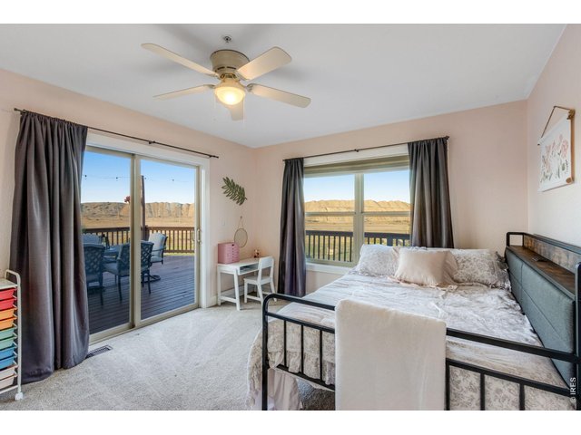 Property Photo 37 2nd bedroom, in-law quarters or guest suite on main level features patio access 