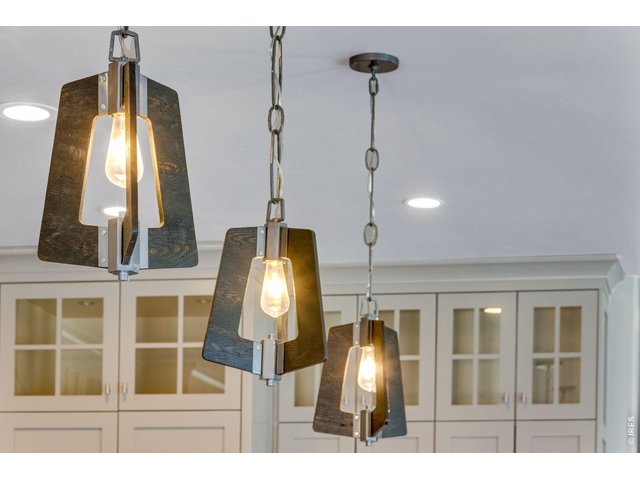 Property Photo 17 Stunning designer light fixtures and notice the glass doors and lighting in cabinets.