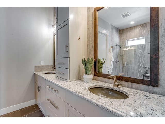 Property Photo 24 Primary dual sinks, quartz tops, custom cabinetry