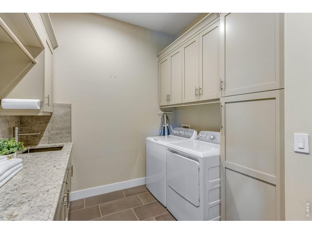 Property Photo 30 Mudroom entry from garage - TONS of cabinets and laundry room sink