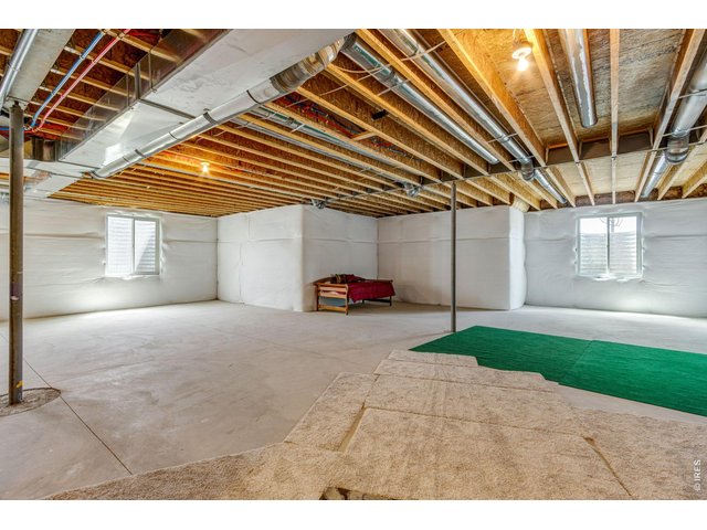 Property Photo 31 Full unfinished basement w/ 9' ceilings and additional bathroom rough-in. Tankless water heater!