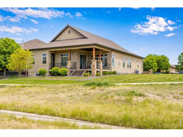 Property Photo 4 Back of home showing covered back patio facing west for stunning Colorado sunsets!