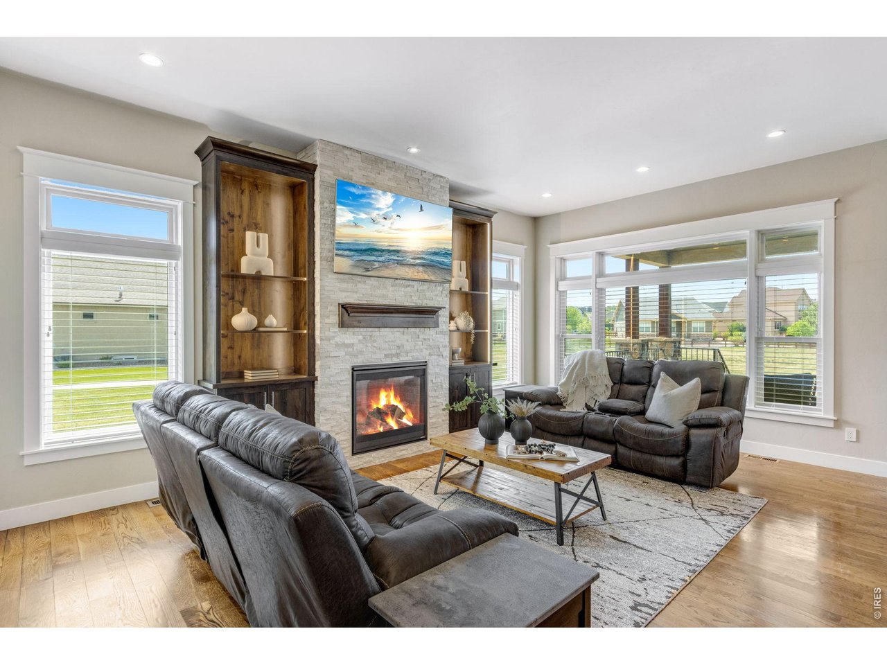 Living room gas fireplace w/ full height stone surround