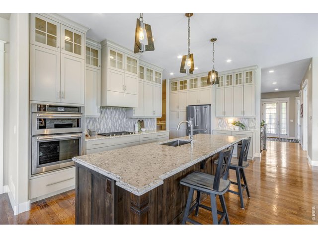 Property Photo 14 Quartz tops and LARGE island, Jenn Air appliances, full tile backsplash