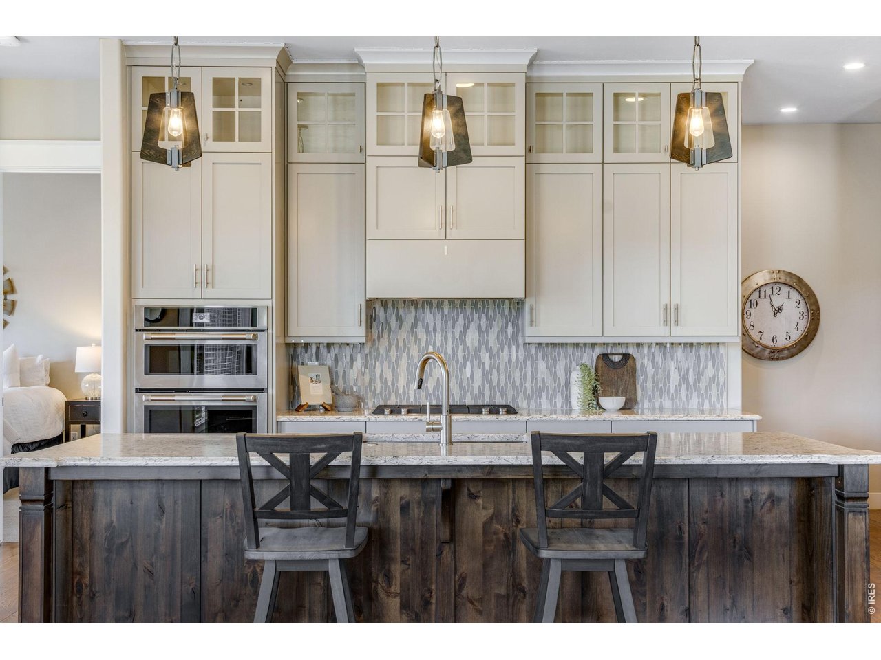 Beautifully updated kitchen w/ painted cabinetry and wood stained island