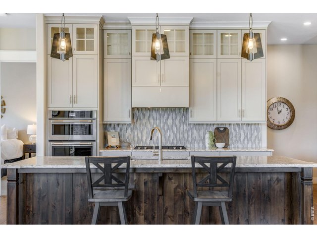 Property Photo 13 Beautifully updated kitchen w/ painted cabinetry and wood stained island