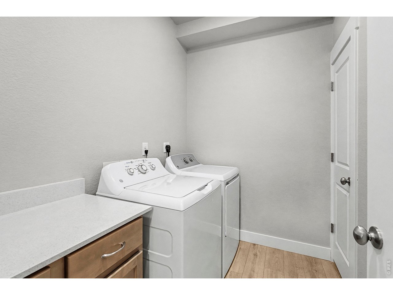 Property Photo 9 Laundry room with built in cabients & quartz countertops. Washer & Dryer included! 