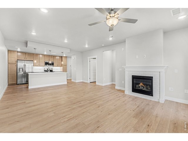 Property Photo 7 Fireplace & Ceiling fan included! 