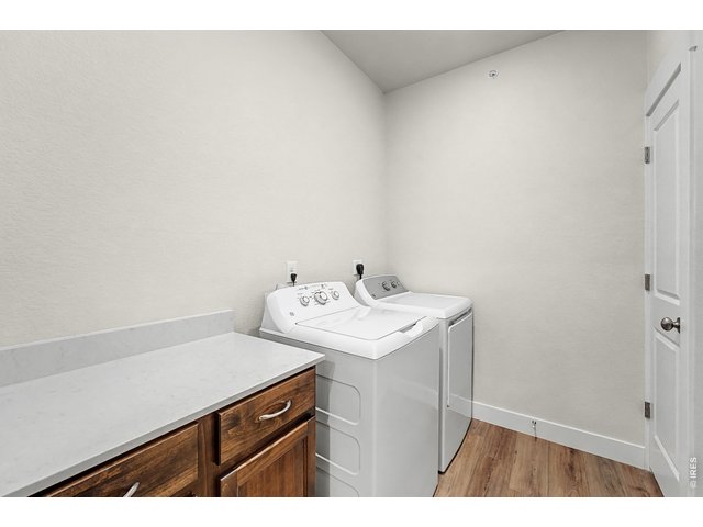 Property Photo 13 Laundry room with built-in cabinets, quartz countertops, and washer/dryer included! 