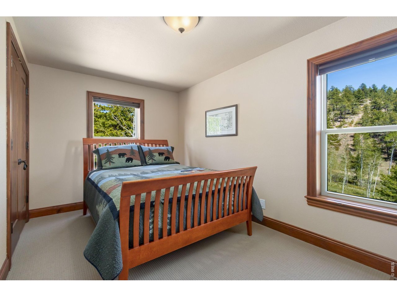 On the main level, there are 2 bedrooms with a full bath to share. This is one of the bedrooms. Spacious closet and new blinds. 