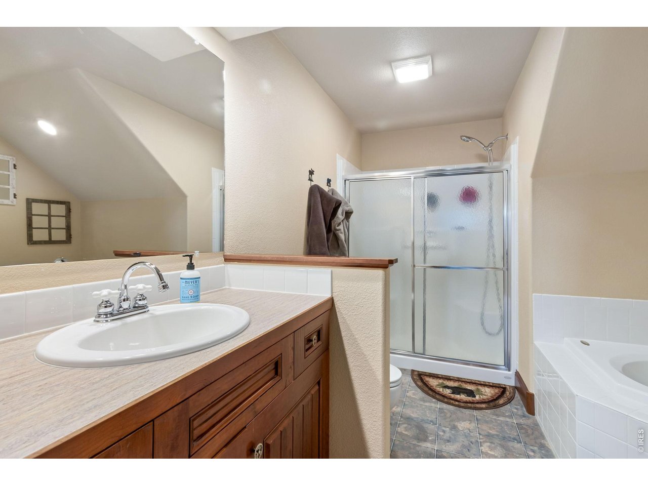 Primary bathroom on the upper level. Complete with oversized shower and jaccuzi tub!