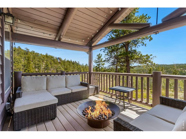 Property Photo 30 The upper deck is a delight, with a gas firepit and comfy outdoor furniture (included). You won't believe the stars from here!