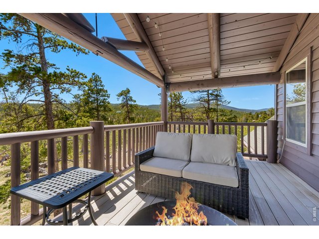 Property Photo 31 Here, on the upper deck, is a truly special and unique space, perfect for enjoying the outdoors and relaxing after a long day.