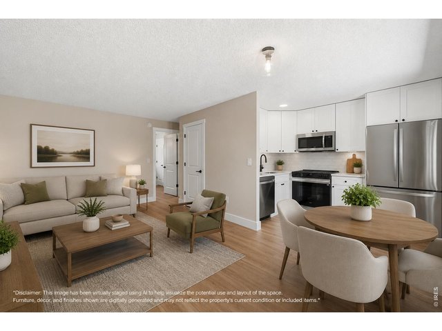 Property Photo 1 Virtually staged living room, dining room and kitchen