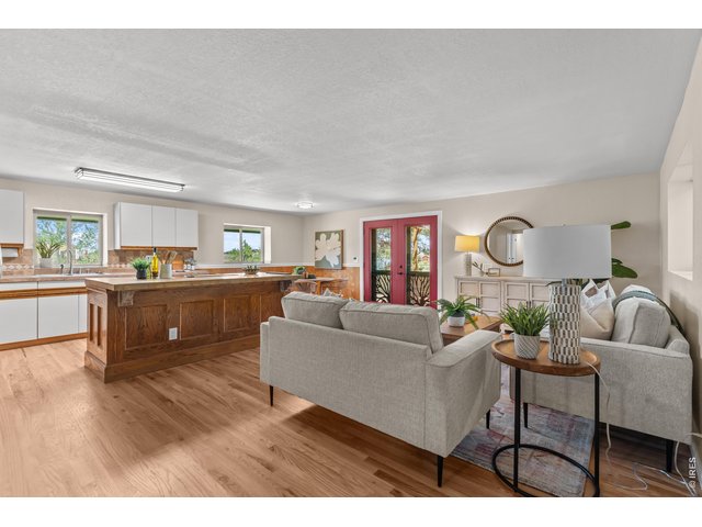Property Photo 3 Refinished hardwood floors, custom patio doors, fresh paint and new lights.