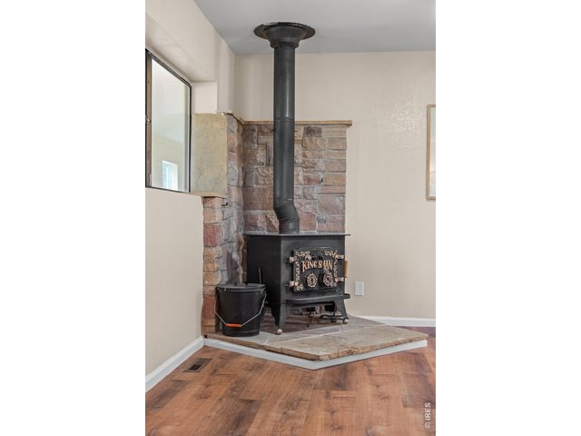 Property Photo 12 Antique Woodburning Stove and Slate rockwall
