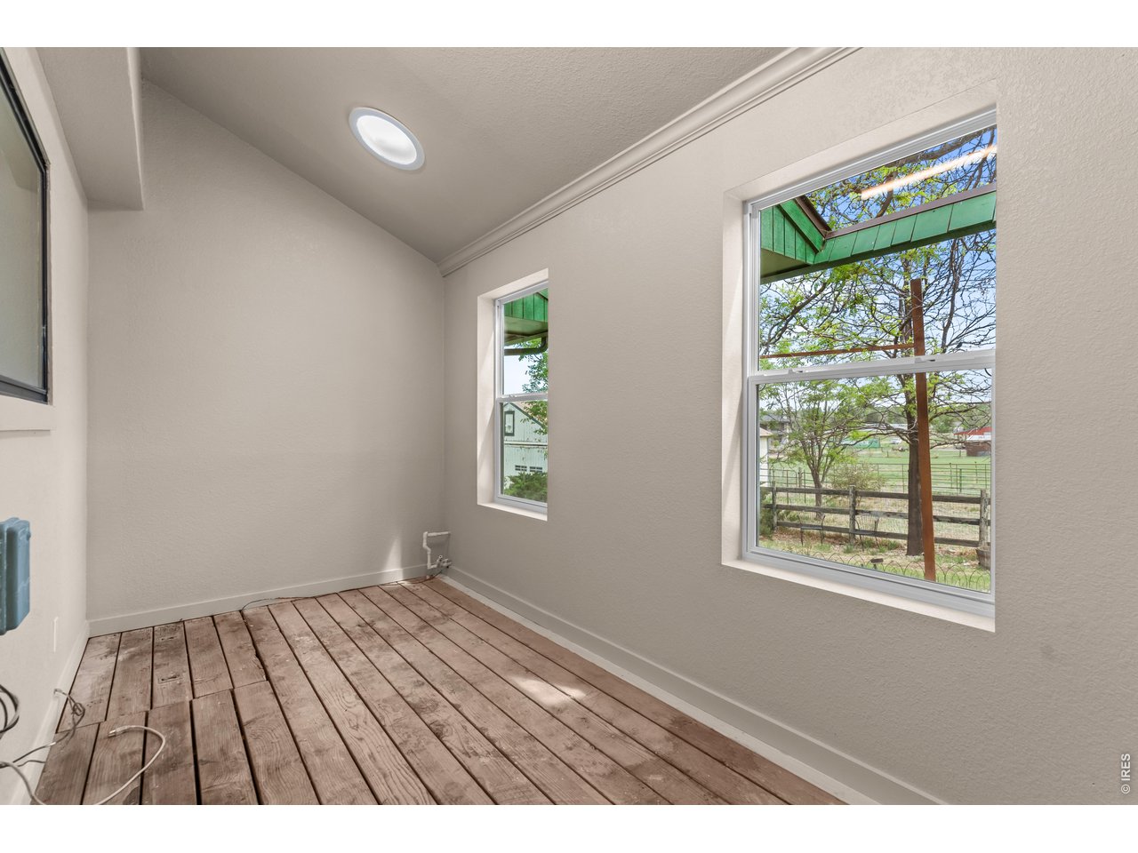 Sunroom storage room with skylights and crawlspace access