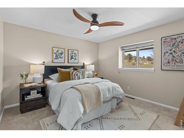 Property Photo 15 Primary Bedroom with new carpet, paint and light fixture