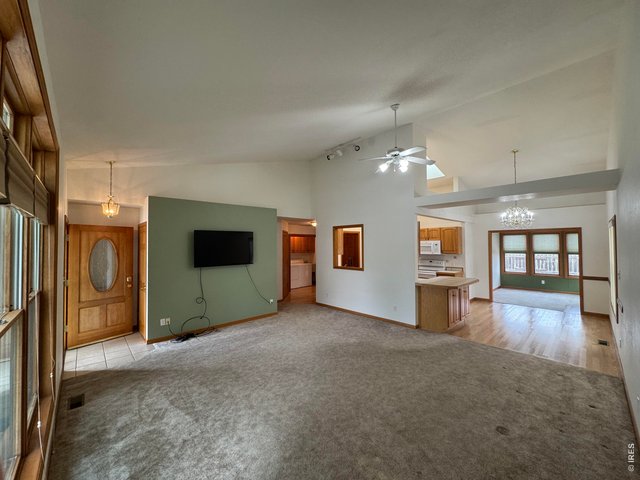 Property Photo 14 view into dining room and Sun Room