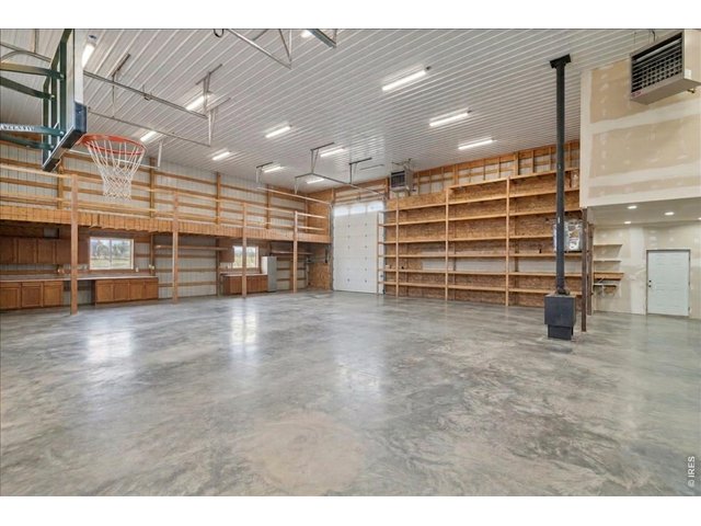 Property Photo 16 3,600 sqft attached heated shop with pass-through doors