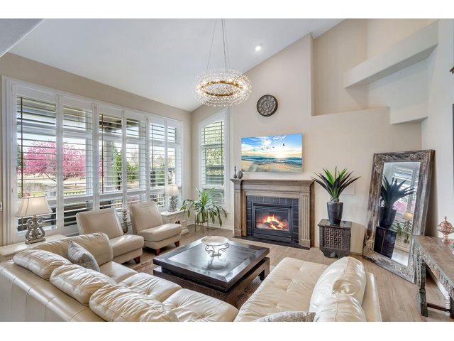 Property Photo 8 Beautiful mouldings - and mantel, cozy main level fireplace, vaulted ceiling, newly refinished HW floor