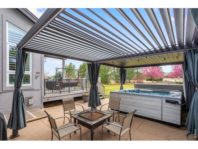 Property Photo 20 This outdoor oasis is nearly 500 SQFT, also features the perfect sitting area and additional gas line for convenient BBQs