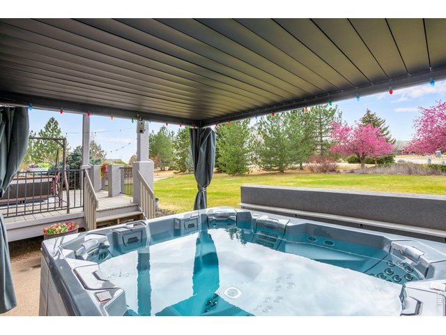 Property Photo 11 Unwind & Relax under the extended patio and pergolas, after a long day in Bullfrog's M9 series hot tub - with 3 pumps (tub + exterior movie projector are sold separately from the property-watch movies from the tub
