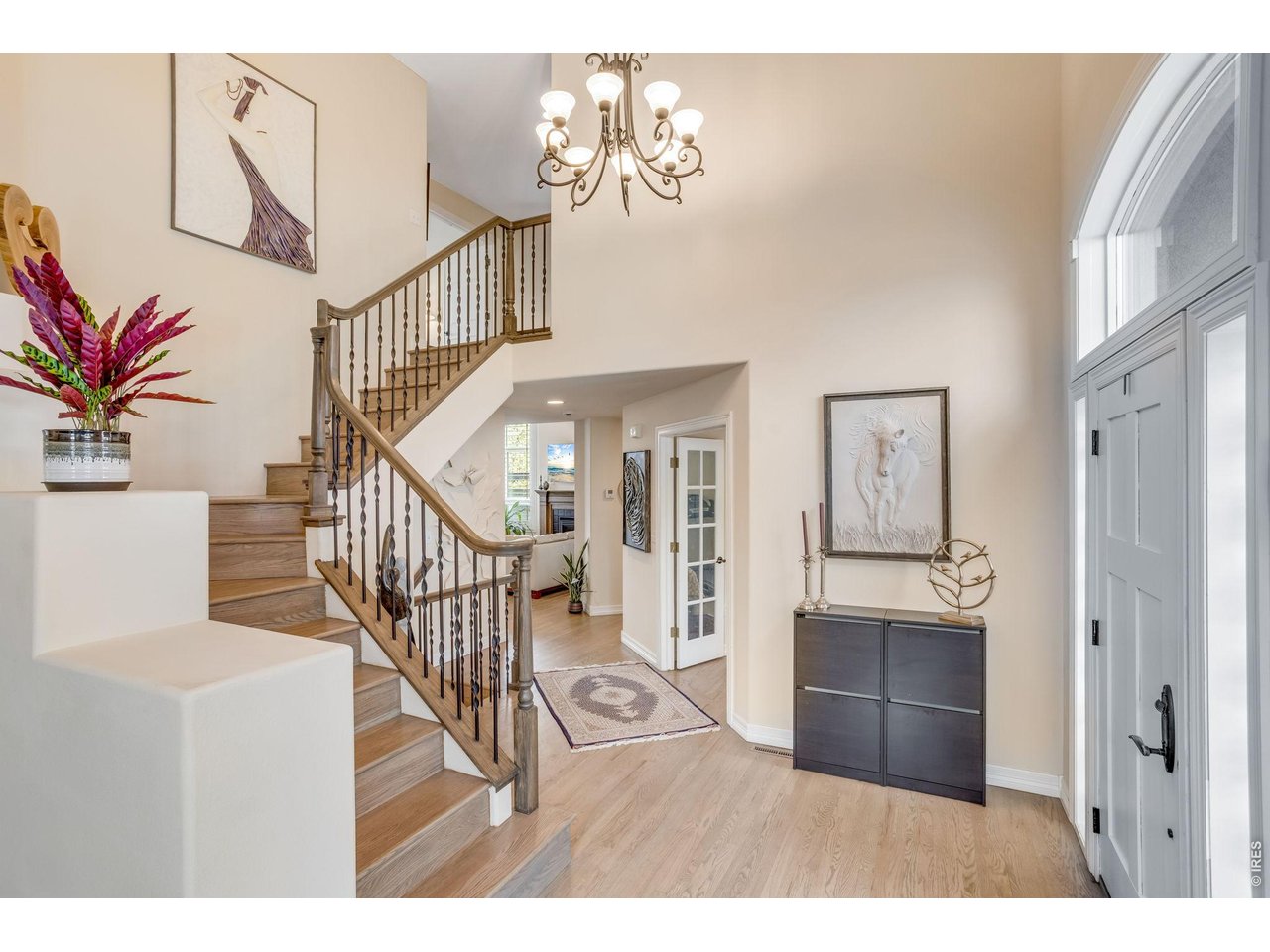 Inside, beautiful intentional detail is evident at every turn, newer hardwood flooring on the upper level + winding staircase - new wrought-iron spindles and fully refinished HW on the main level.