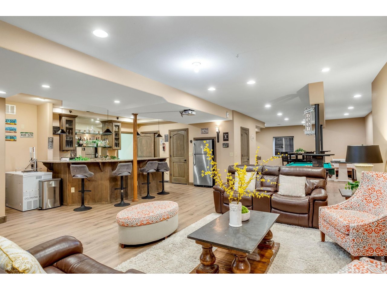  & the finished lower level! Expanding the home's versatility with a stunning extensive granite wet bar, generous recreation space!
