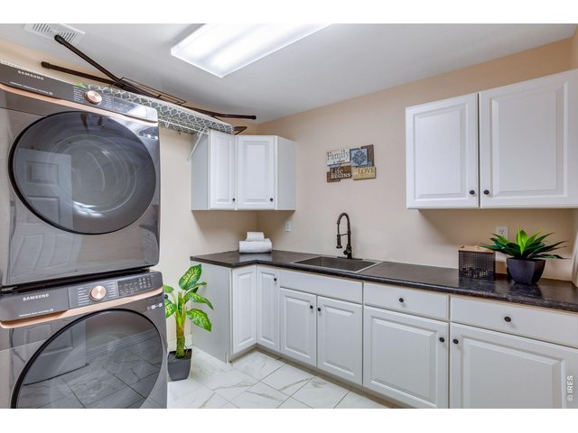 Property Photo 49 Refreshed spacious main level laundry and mudroom, includes newer Washer and Dryer, less than 1 year old.