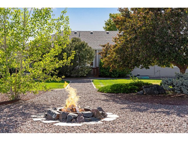Property Photo 47 Backyard in ground firepit - ready for those smores?