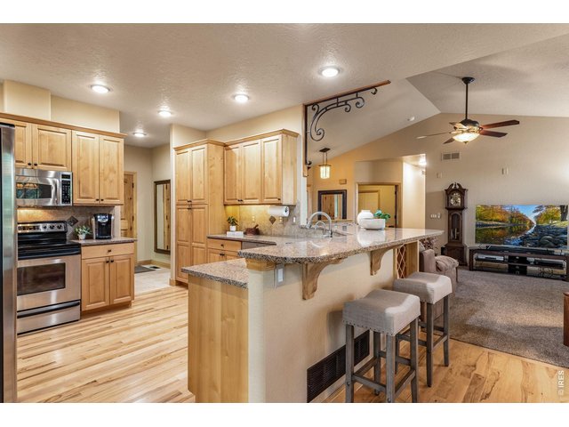 Property Photo 17 Loaded with storage & countertop space! Shiny site finished Hickory floors! 