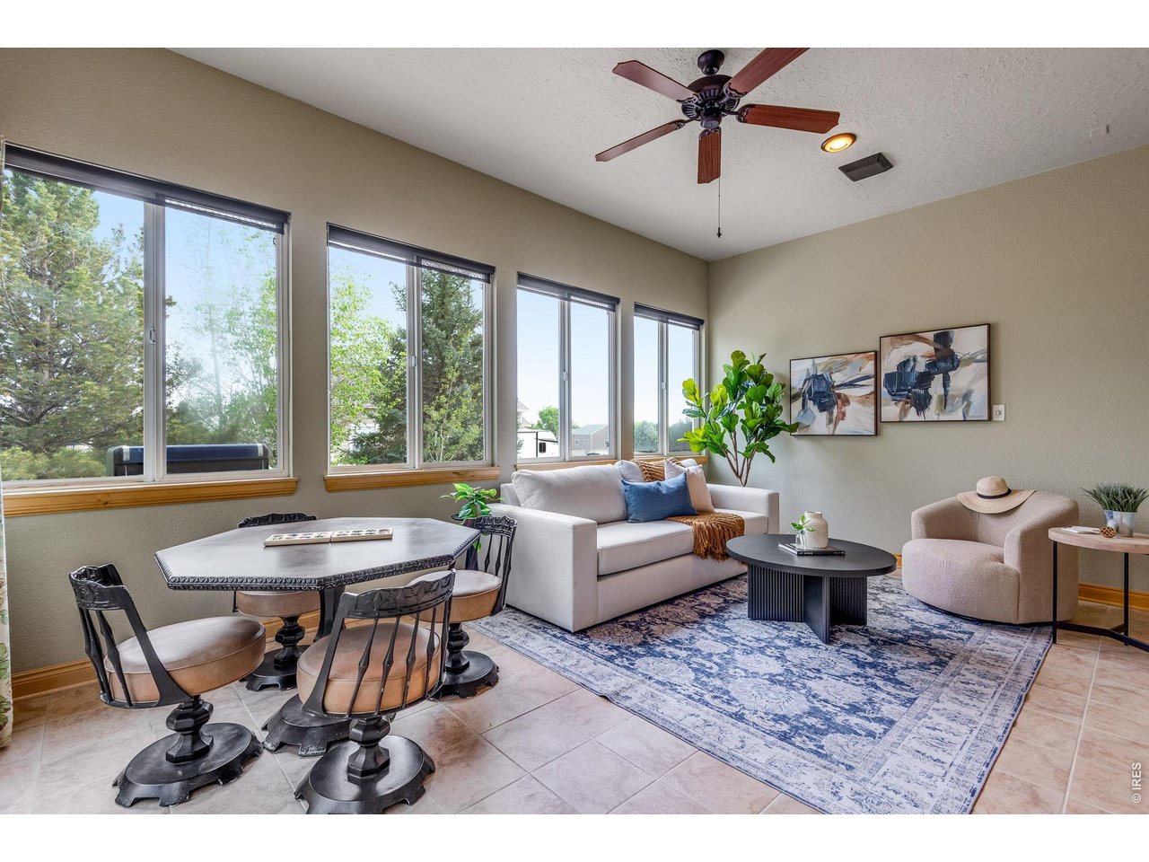 Low maintenace tile flooring, ceiling fan, Milgard Windows. 