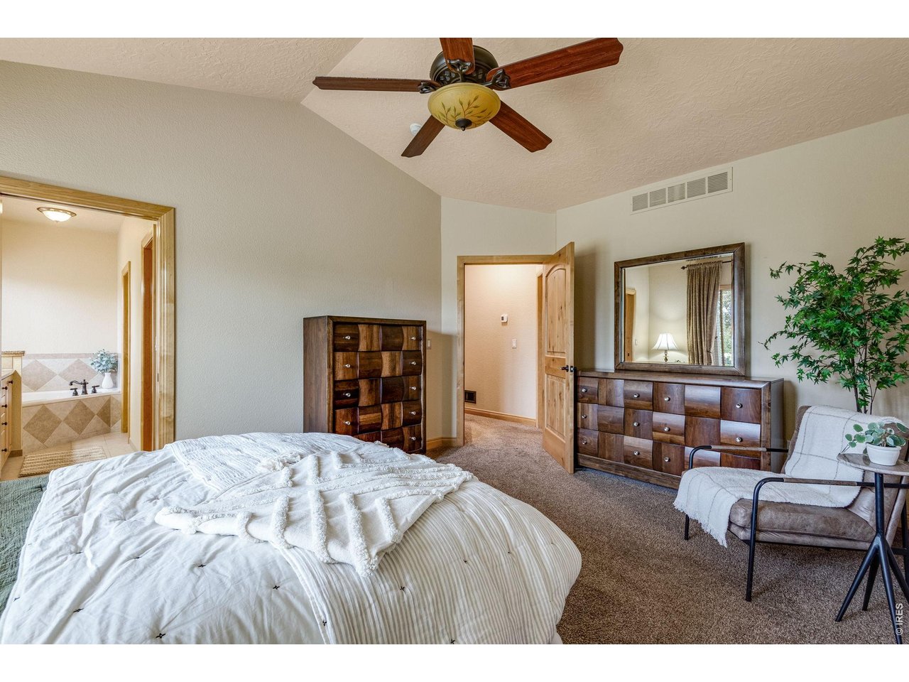 Another angle Primary Suite, with a 5 piece bathroom, jetted garden tub and walk-in closet! 